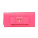 High Quality Imitation Prada Saffiano Leather Wallet with Leather Bow 1M1132B Rosy Tl6751Vu82